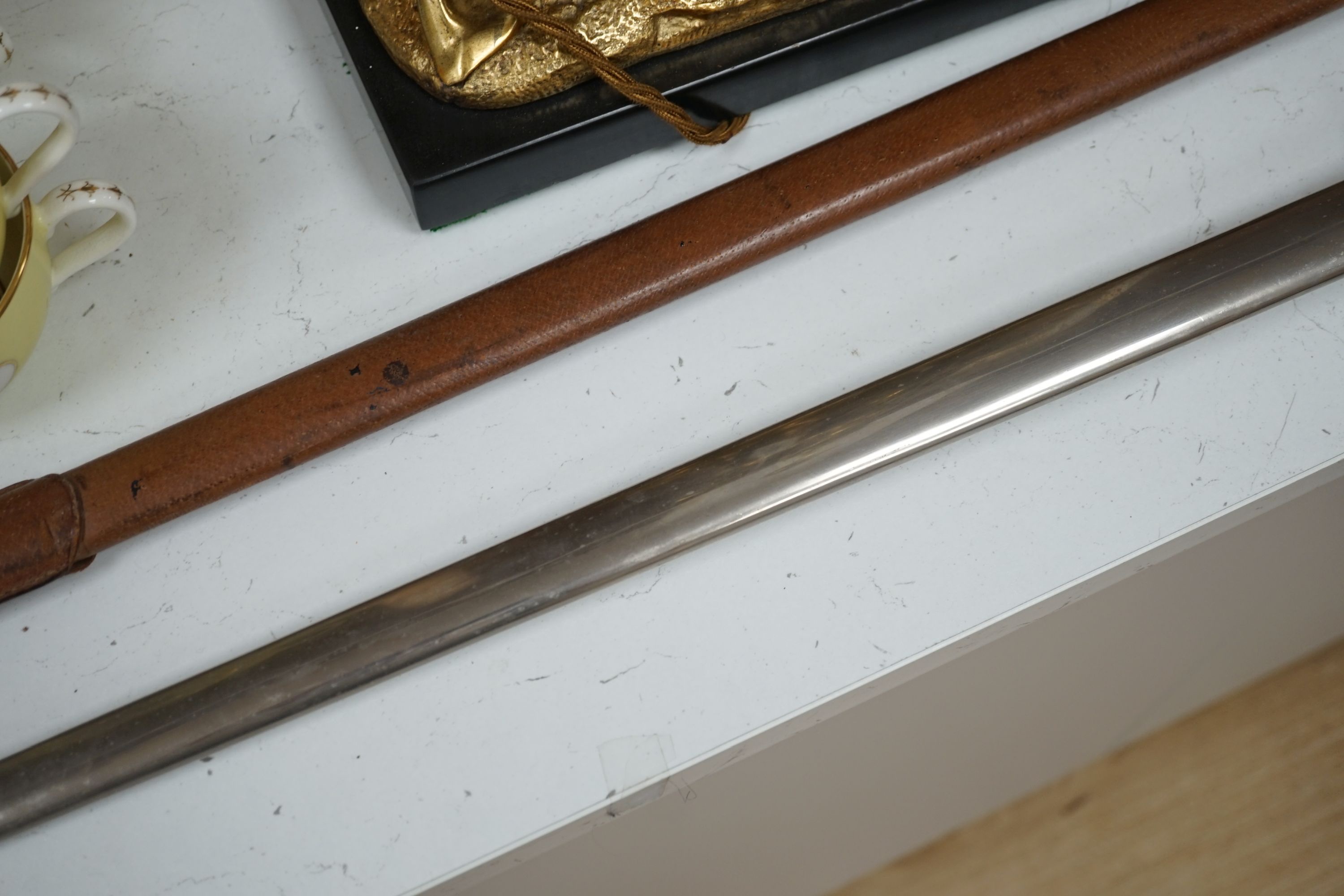 An Edward VII officer’s dress sword with leather case - 102cm long